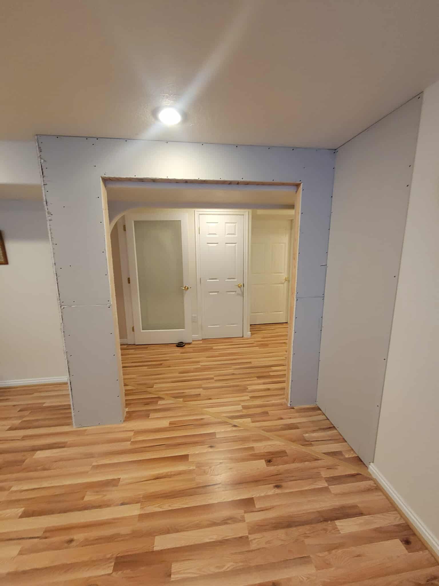 Basement during construction with drywall and framing